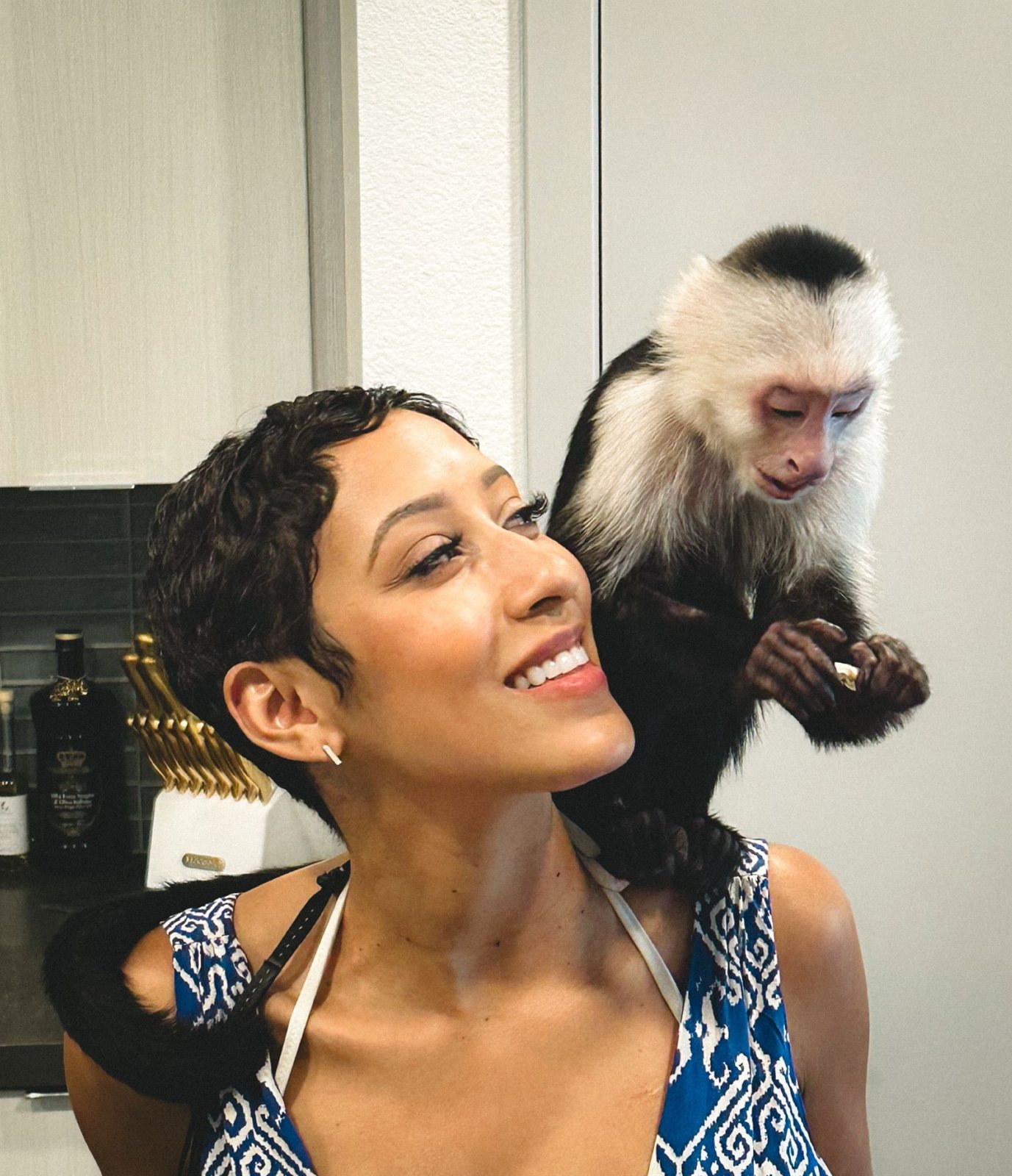 Ashley Nicole Singleton with "Sugar" Shane Mosley's monkey, Tito