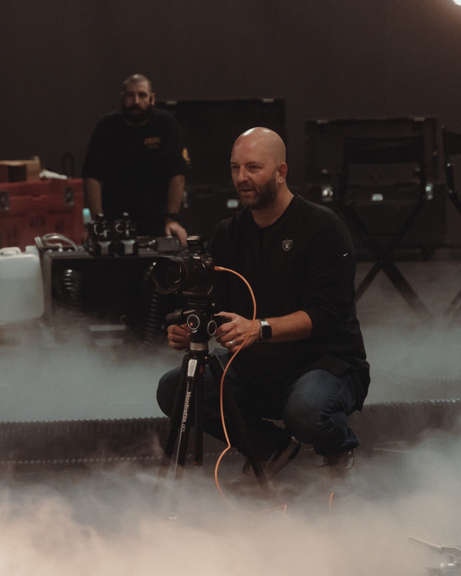 Camera operator shooting on the fogged set