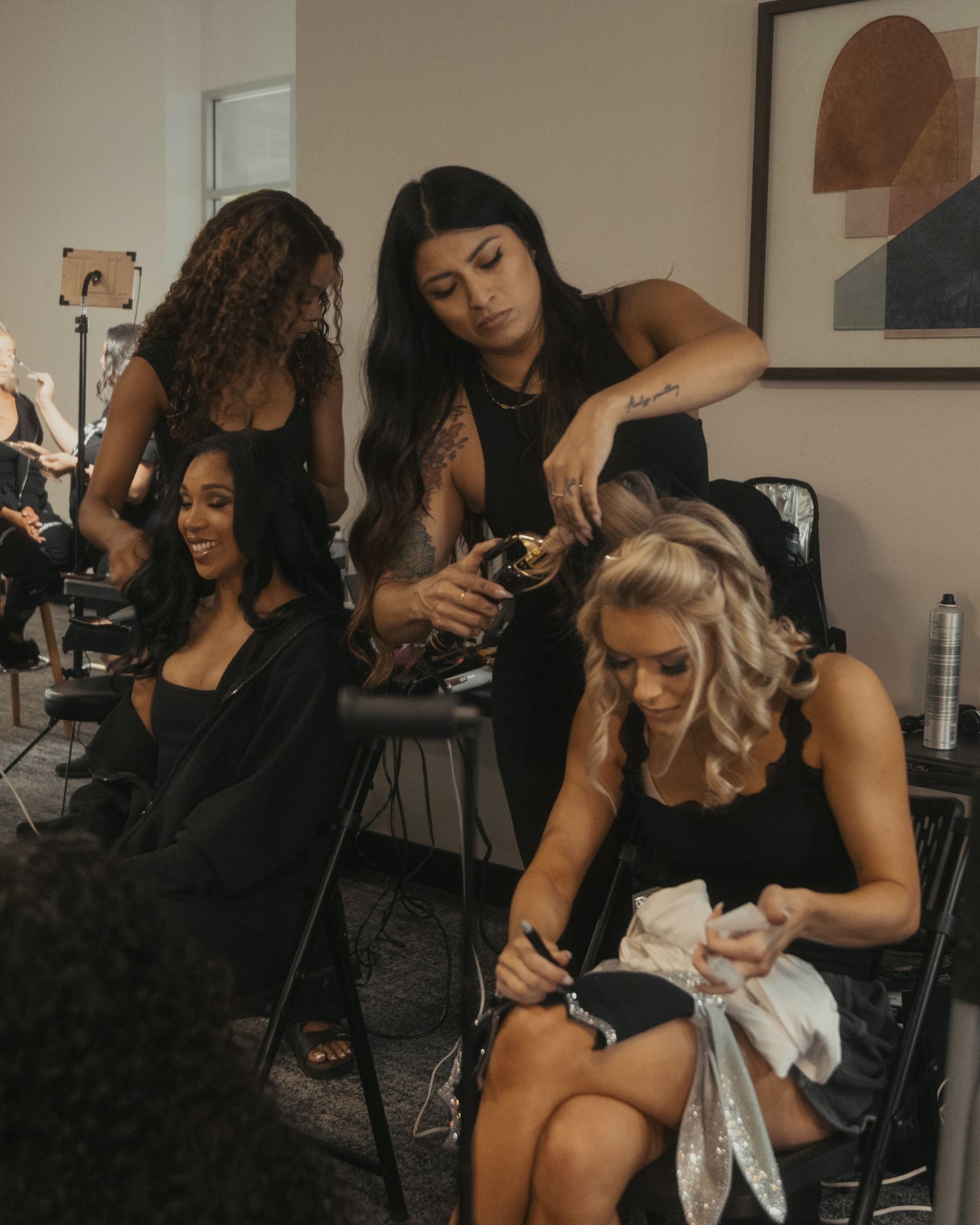 Stylists prepping the squad in the glam room